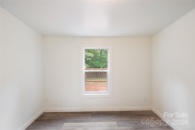 empty room with hardwood / wood-style flooring