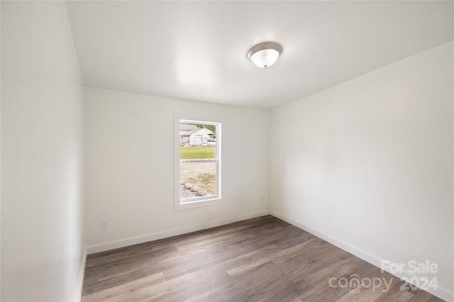 empty room featuring wood-type flooring