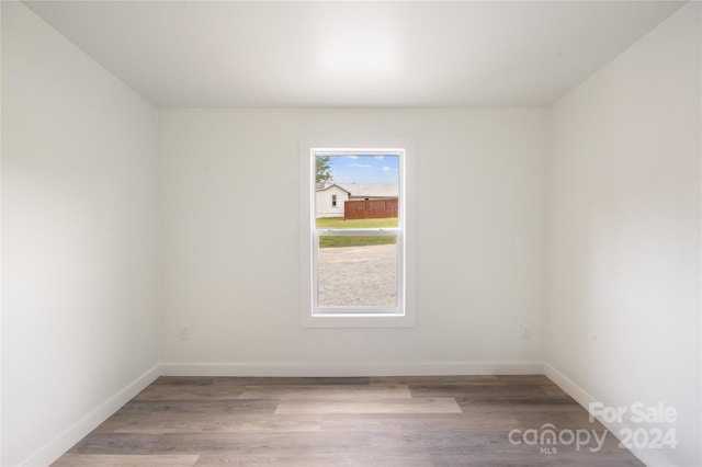 spare room featuring light hardwood / wood-style floors