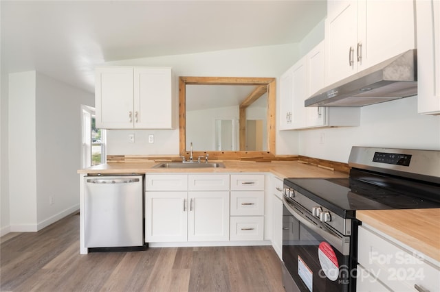 kitchen featuring appliances with stainless steel finishes, white cabinets, and sink