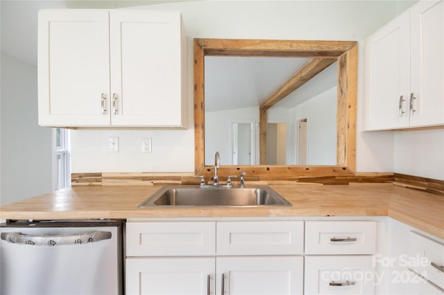 kitchen with white cabinetry, dishwasher, and sink