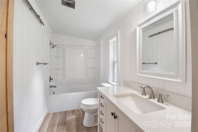 full bathroom featuring shower / tub combination, toilet, hardwood / wood-style floors, and vanity