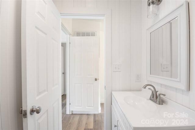 bathroom featuring hardwood / wood-style flooring and vanity