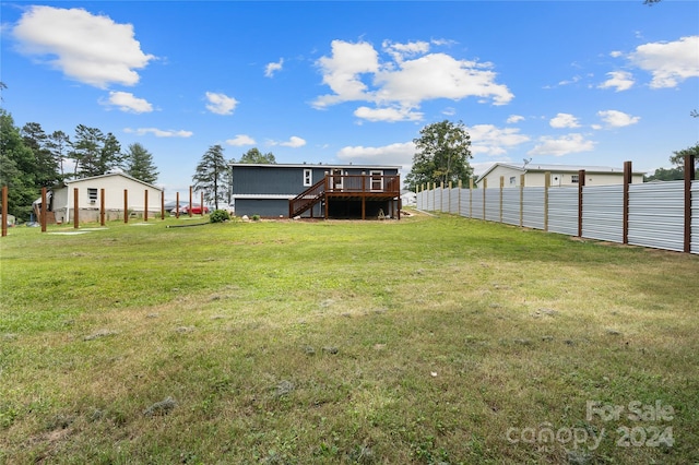 view of yard featuring a wooden deck