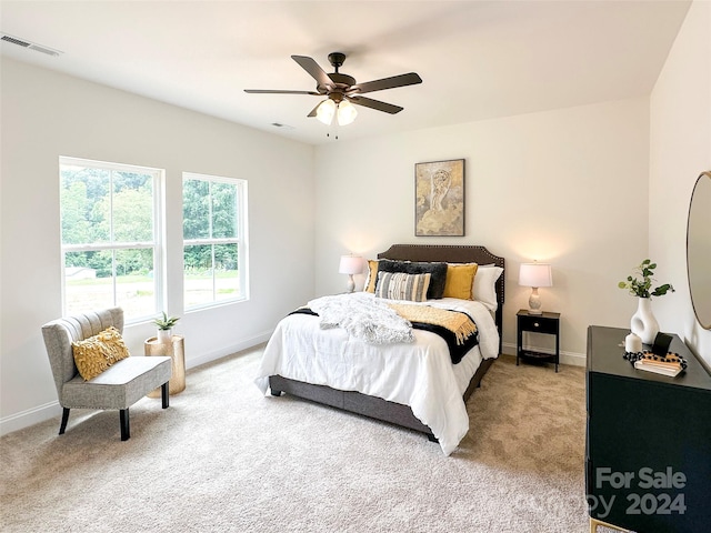 carpeted bedroom featuring ceiling fan