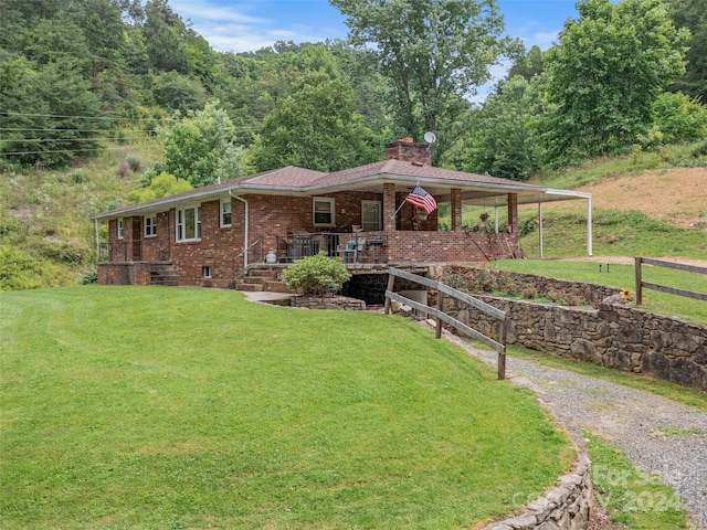 view of front of house featuring a front lawn and covered porch