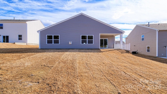 back of house featuring central air condition unit