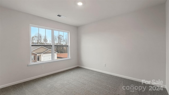 unfurnished room with carpet floors