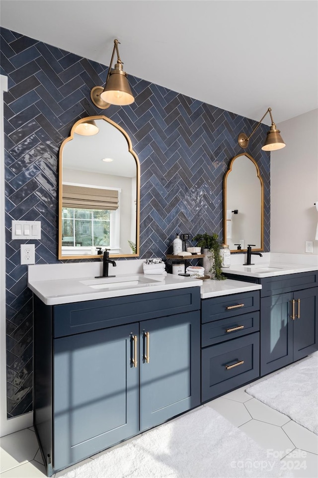 bathroom with tile patterned flooring, vanity, and tile walls