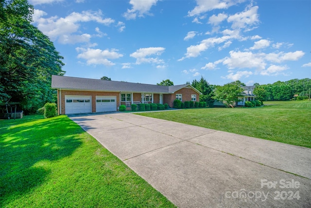 ranch-style house with a front yard and a garage