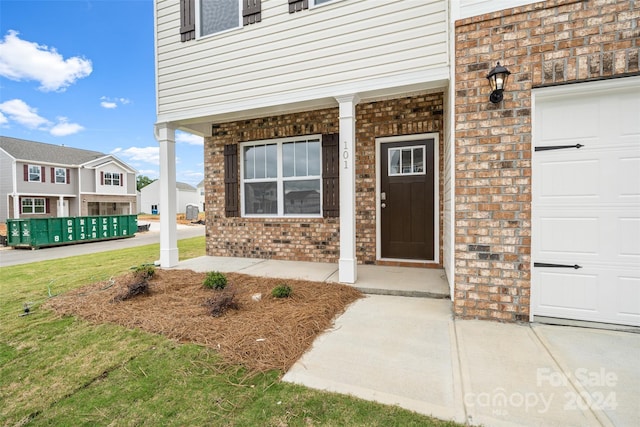 entrance to property with covered porch