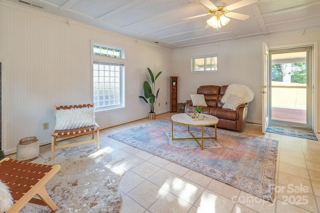 living room with ceiling fan and a healthy amount of sunlight