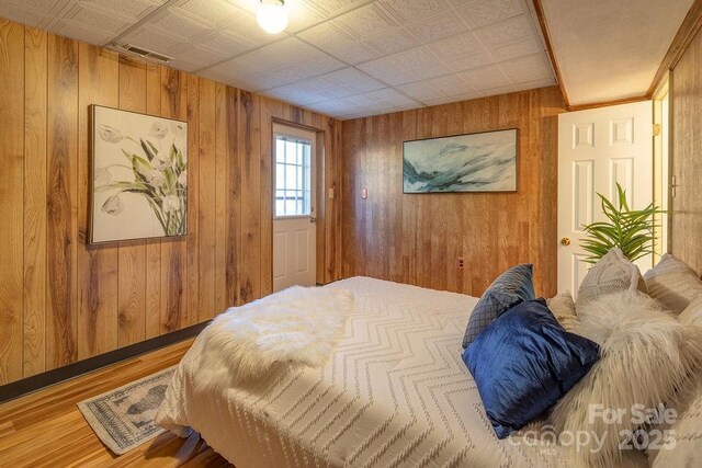 bedroom with hardwood / wood-style floors