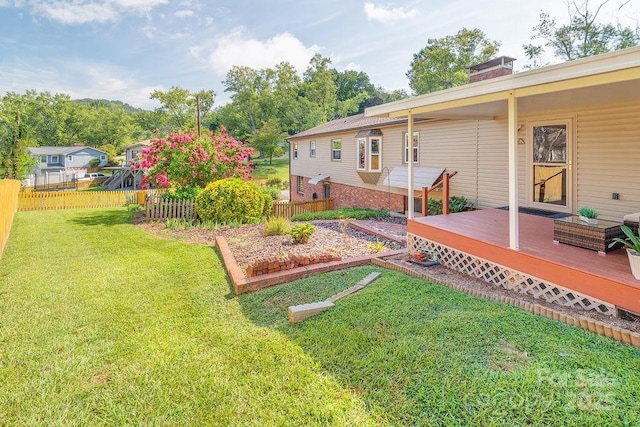 view of yard featuring a deck