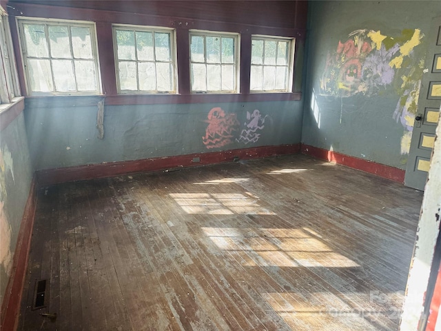 empty room featuring dark hardwood / wood-style flooring