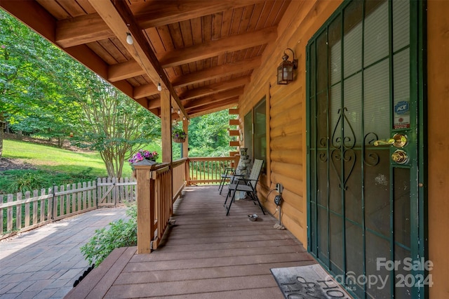 wooden terrace featuring a porch