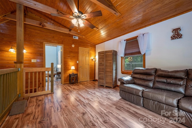 living room with light hardwood / wood-style floors, wood walls, wooden ceiling, high vaulted ceiling, and beamed ceiling