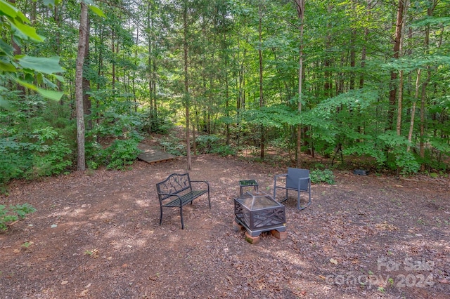 view of patio with a fire pit