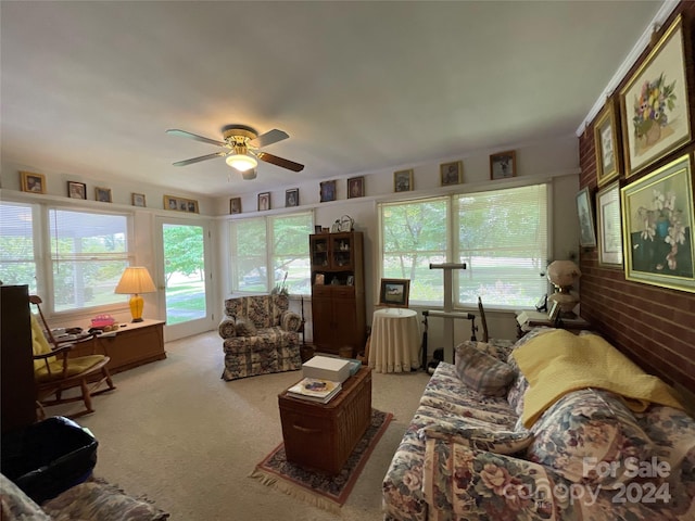 carpeted living room with ceiling fan