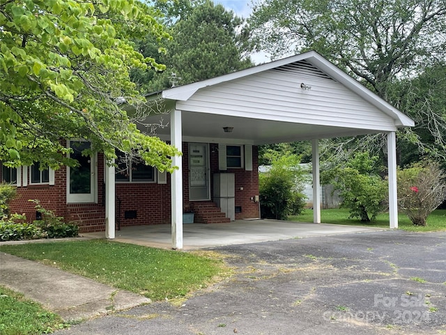 view of front of home featuring a carport