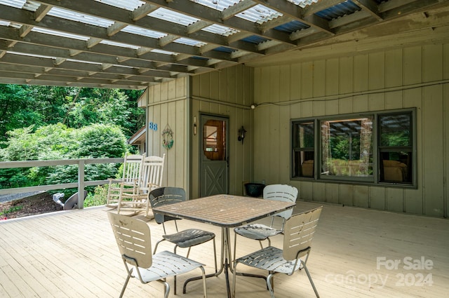 wooden terrace with a pergola