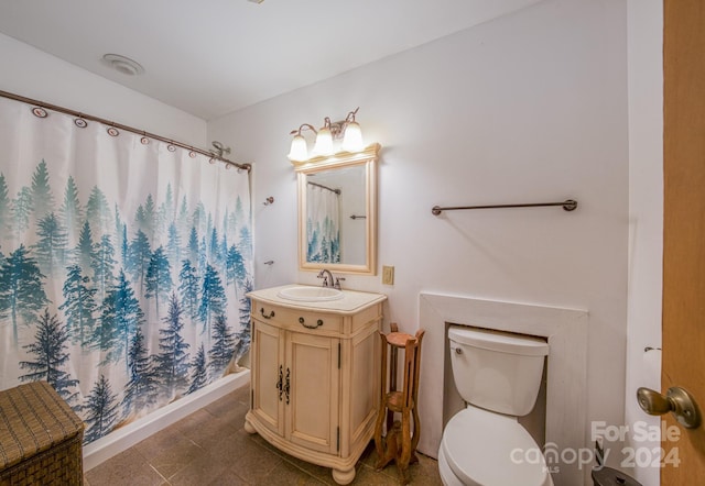 bathroom with toilet, vanity, and a shower with curtain