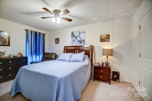 carpeted bedroom with ceiling fan