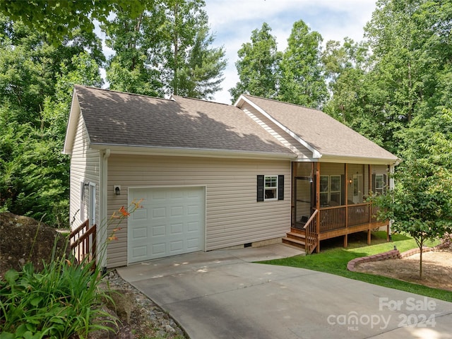 view of front of home featuring a porch and a garage