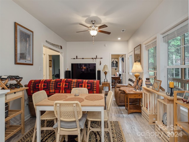 dining room with hardwood / wood-style flooring and ceiling fan