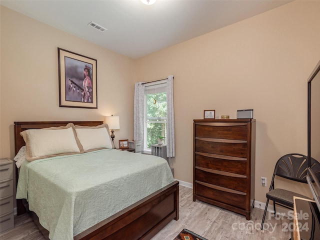 bedroom with light hardwood / wood-style flooring