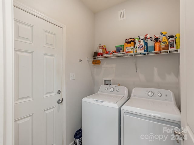 washroom featuring independent washer and dryer