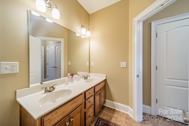 bathroom with tile patterned flooring and vanity