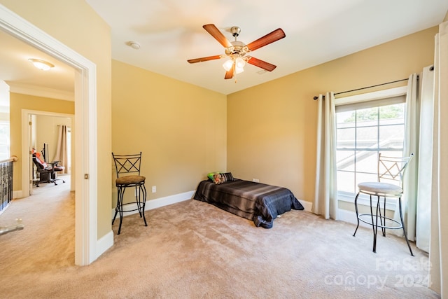 bedroom with light carpet and ceiling fan