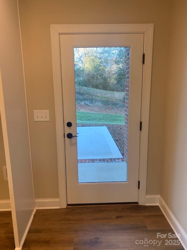 entryway with dark wood-type flooring