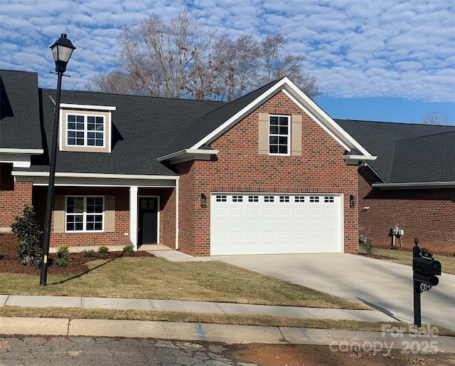 view of front property with a front yard and a garage