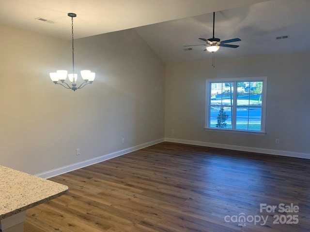 unfurnished dining area featuring dark hardwood / wood-style floors, lofted ceiling, and ceiling fan with notable chandelier