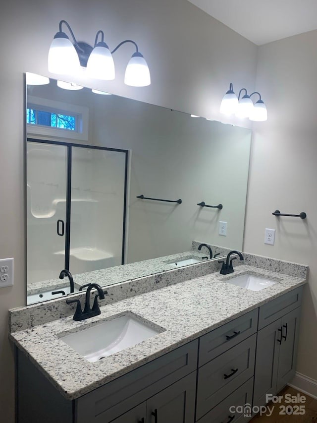 bathroom with vanity and an enclosed shower