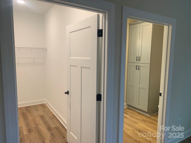 hallway with light wood-type flooring