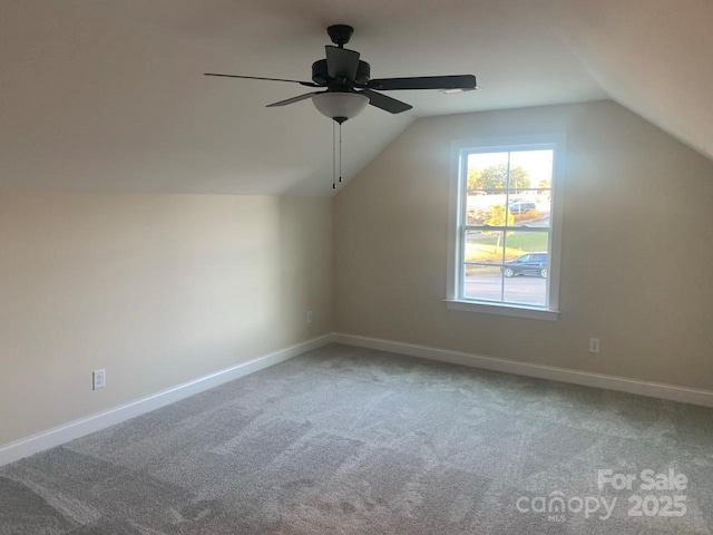 bonus room featuring ceiling fan, carpet, and lofted ceiling