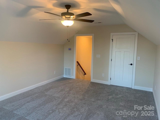 additional living space featuring carpet floors, ceiling fan, and lofted ceiling