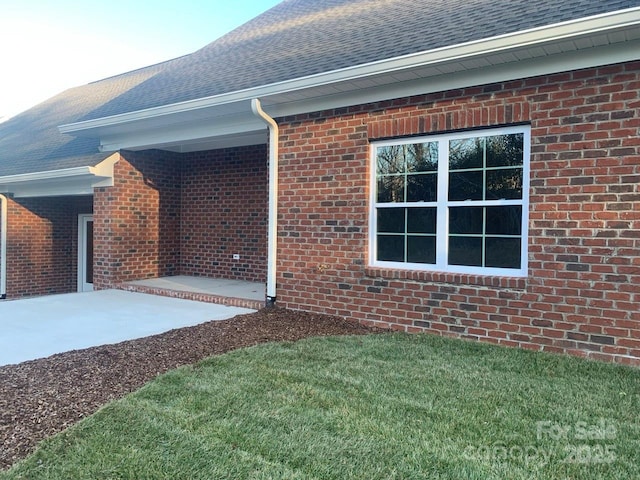 view of side of home featuring a patio area