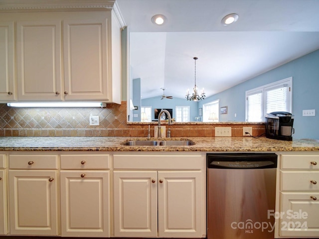 kitchen with sink, stainless steel dishwasher, backsplash, decorative light fixtures, and lofted ceiling