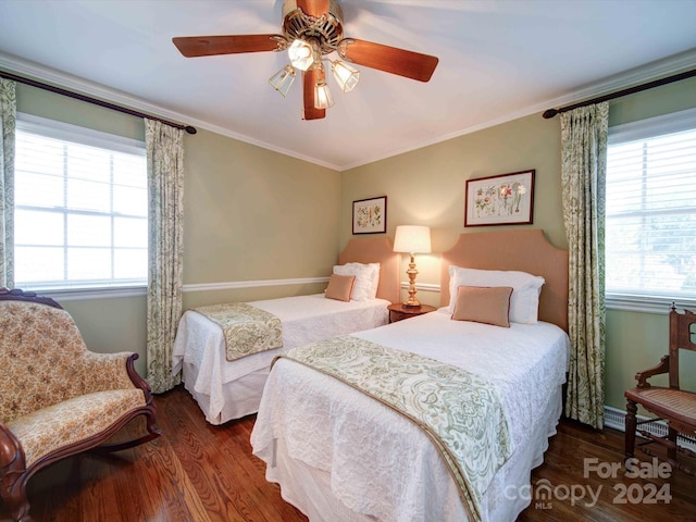 bedroom with ceiling fan, dark hardwood / wood-style flooring, and crown molding