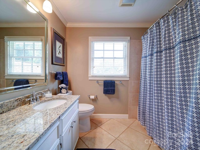 bathroom featuring vanity, crown molding, tile patterned flooring, toilet, and walk in shower