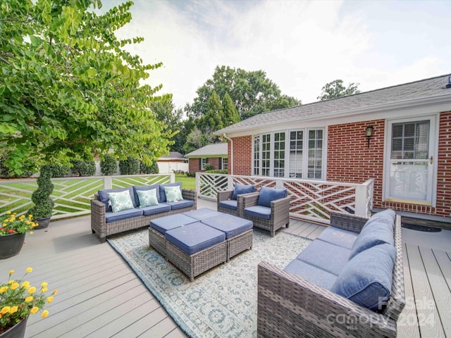 deck with an outdoor hangout area and a lawn