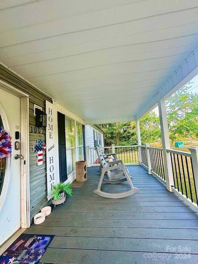 wooden deck with a porch