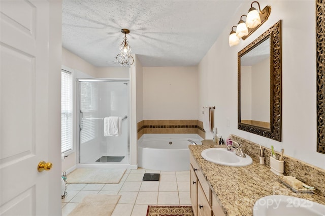 21 Farm Valley Ct, Weaverville, NC 28787 - bathroom with tile patterned flooring, a shower stall, a bath, double vanity, and a textured ceiling