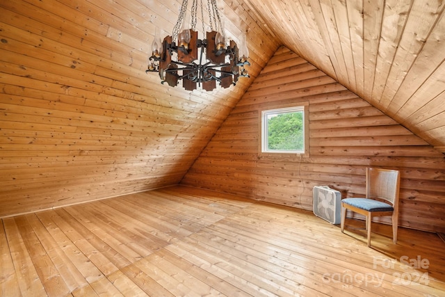 bonus room featuring light hardwood / wood-style floors, wood ceiling, rustic walls, and vaulted ceiling