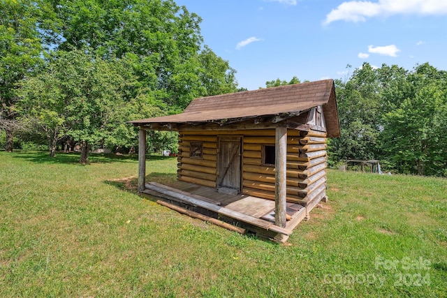 view of outdoor structure with a lawn