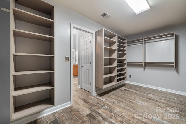 walk in closet featuring wood-type flooring